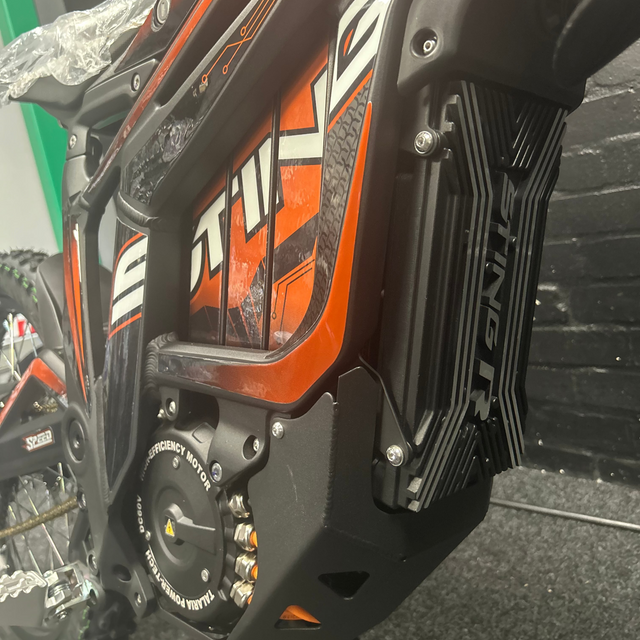 Close-up of a Talaria motorcycle with visible branding.