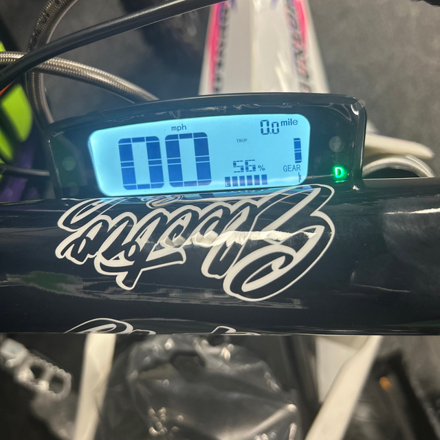 Digital display on a motorcycle with 'Harley-Davidson' branding.