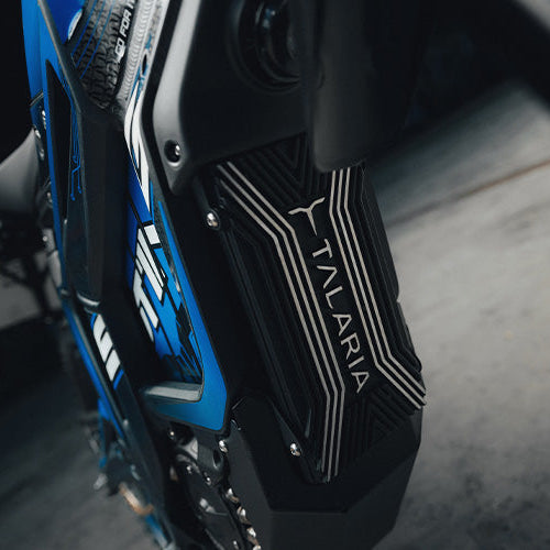 Close-up of a motorcycle with 'Talara' branding on a dark background