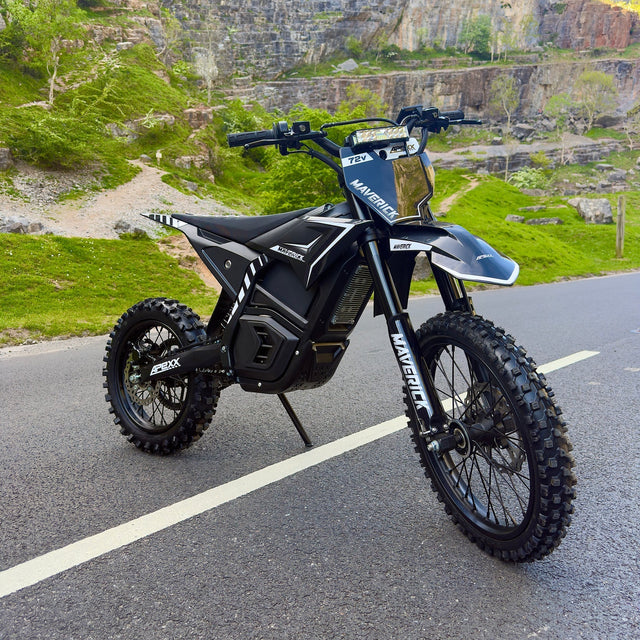 Electric bike on a road with a scenic background of cliffs and greenery