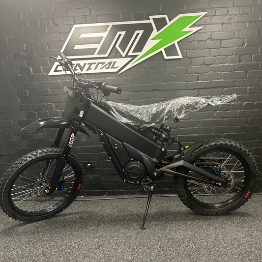 Black electric bike in front of a branded wall