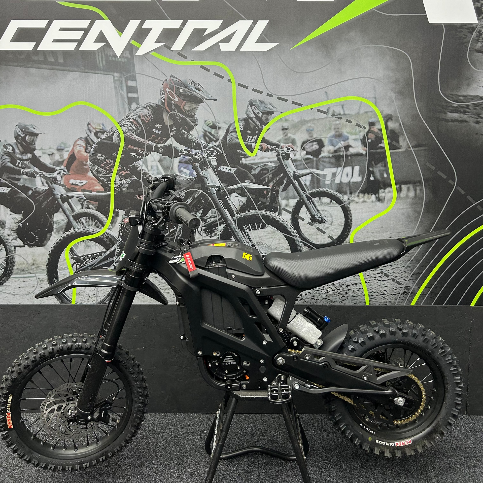 Black electric bike with 'EMX Central' branding in the background