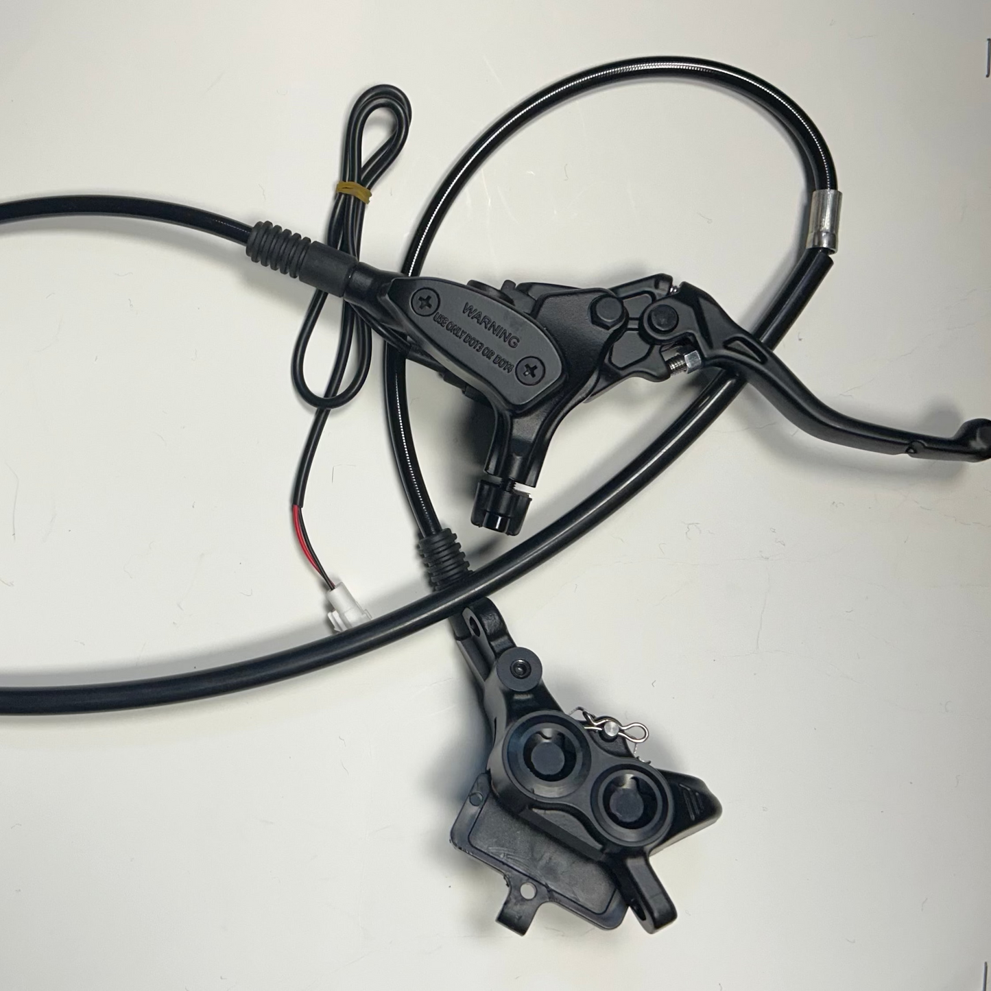 Bicycle brake cable and housing on a white background