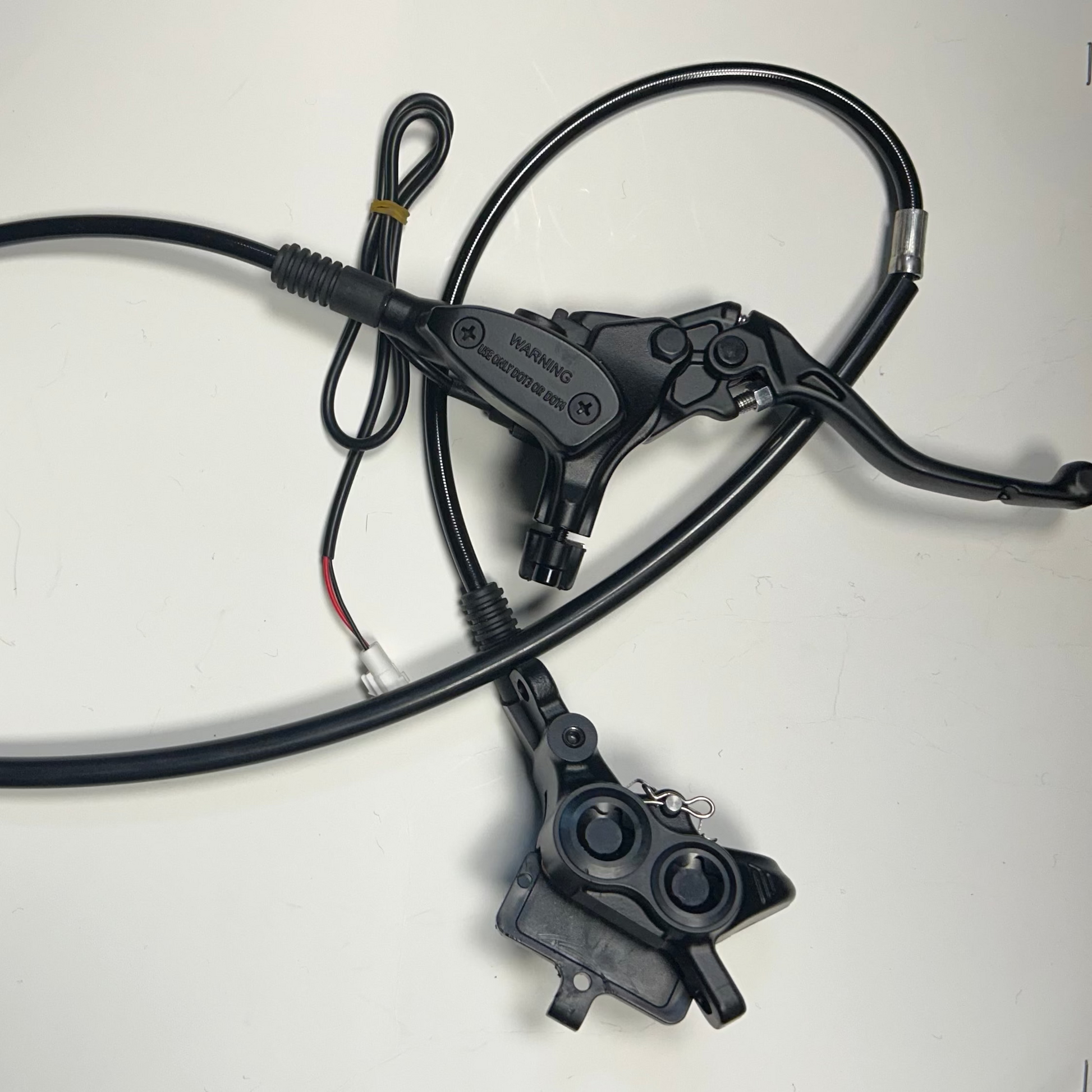 Bicycle brake cable and housing on a white background