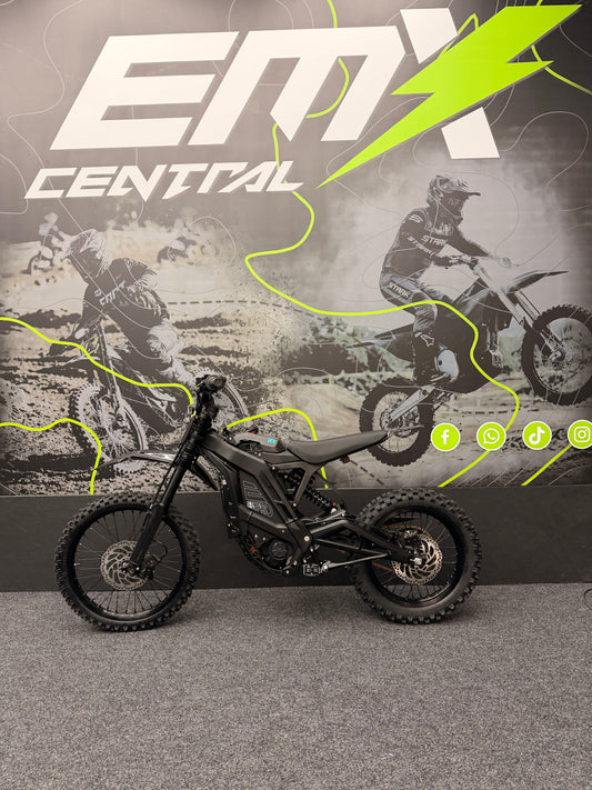 Motorcycle in front of a promotional backdrop with 'EMX Central' branding.