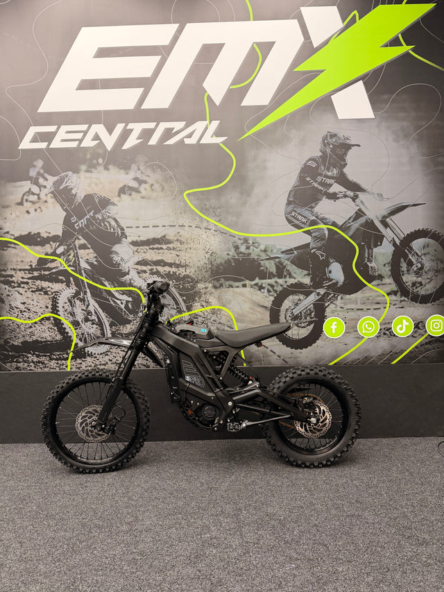 Motorcycle in front of a promotional backdrop with 'EMX Central' branding.