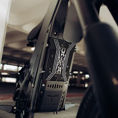 Close-up of a motorcycle seat and frame inside a vehicle.