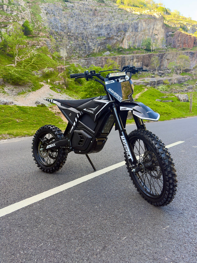 Electric bike on a road with a scenic background of cliffs and greenery