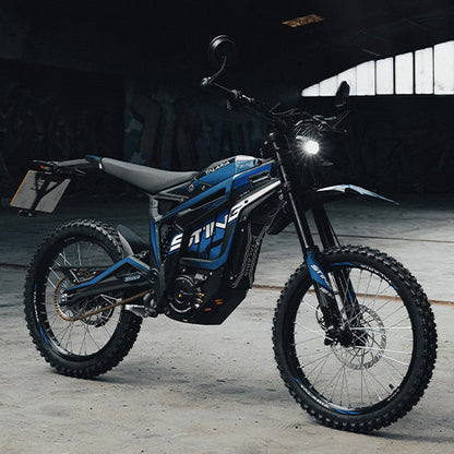 Blue electric bike with 'E-TWIN' branding on a dark background