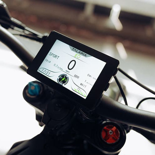 Bicycle handlebar with digital speedometer display on a blurred background