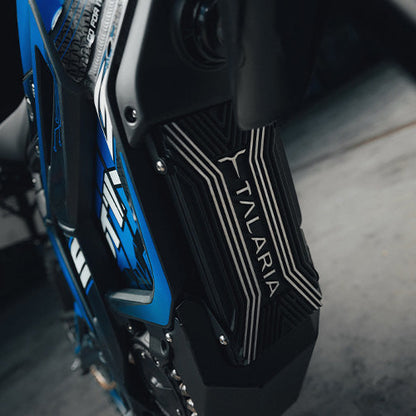 Close-up of a motorcycle with 'Talara' branding on a dark background