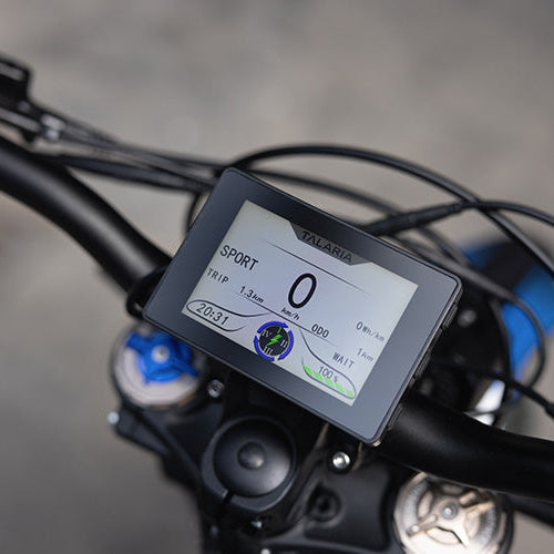 Digital display on a bicycle handlebar with blurred background